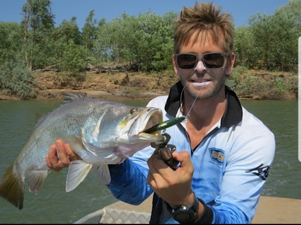 Mark LeCras holding a fish he caught